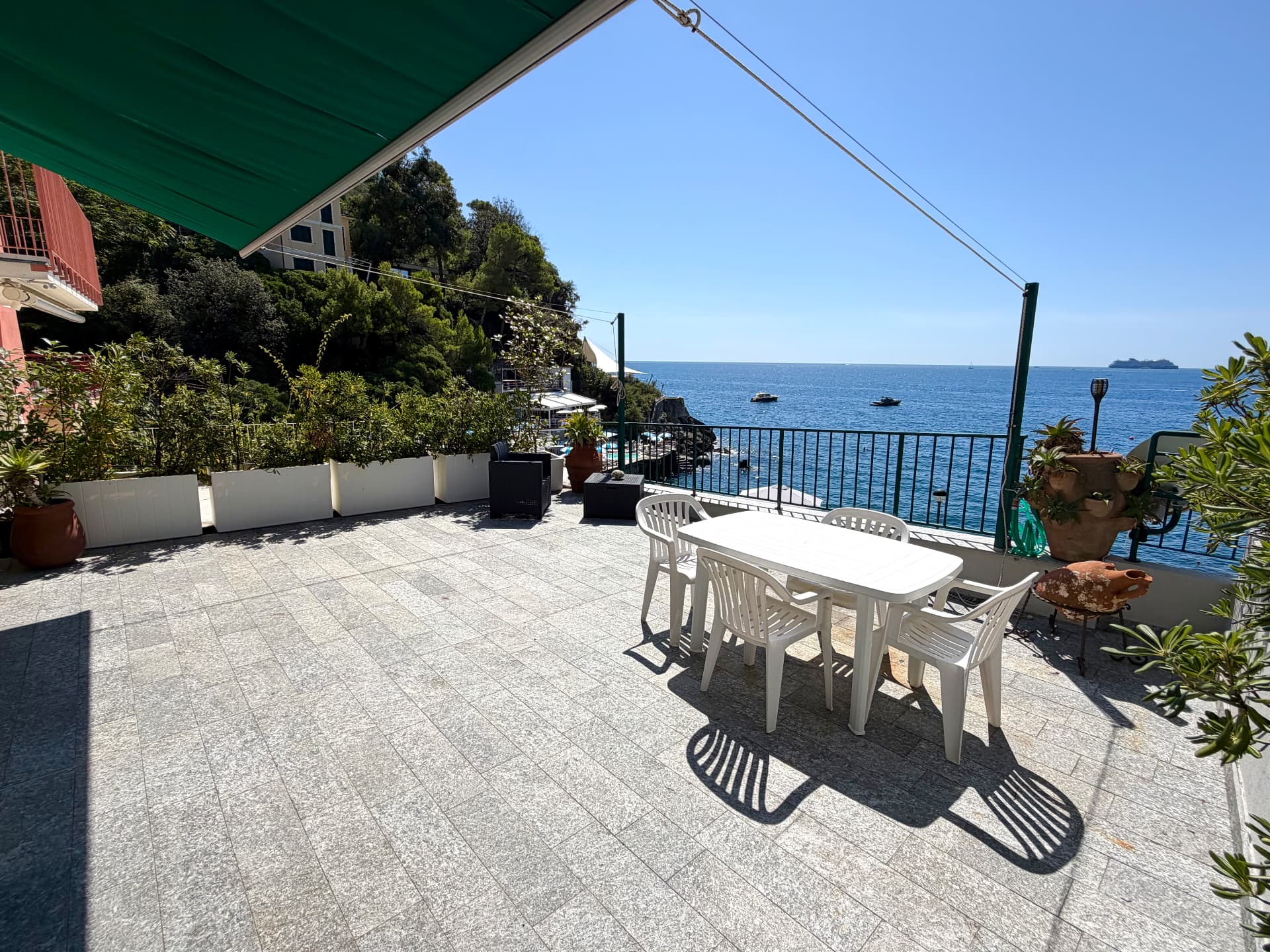 Outdoor dining terrace with sea views at Villa Maria Luisa