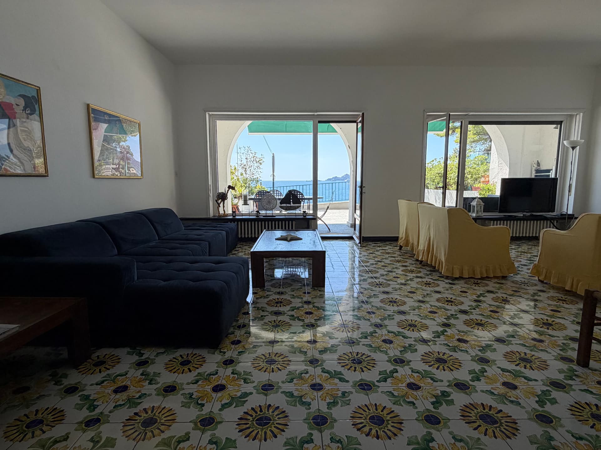 Sea-view salon of Villa Maria Luisa with floor-to-ceiling windows