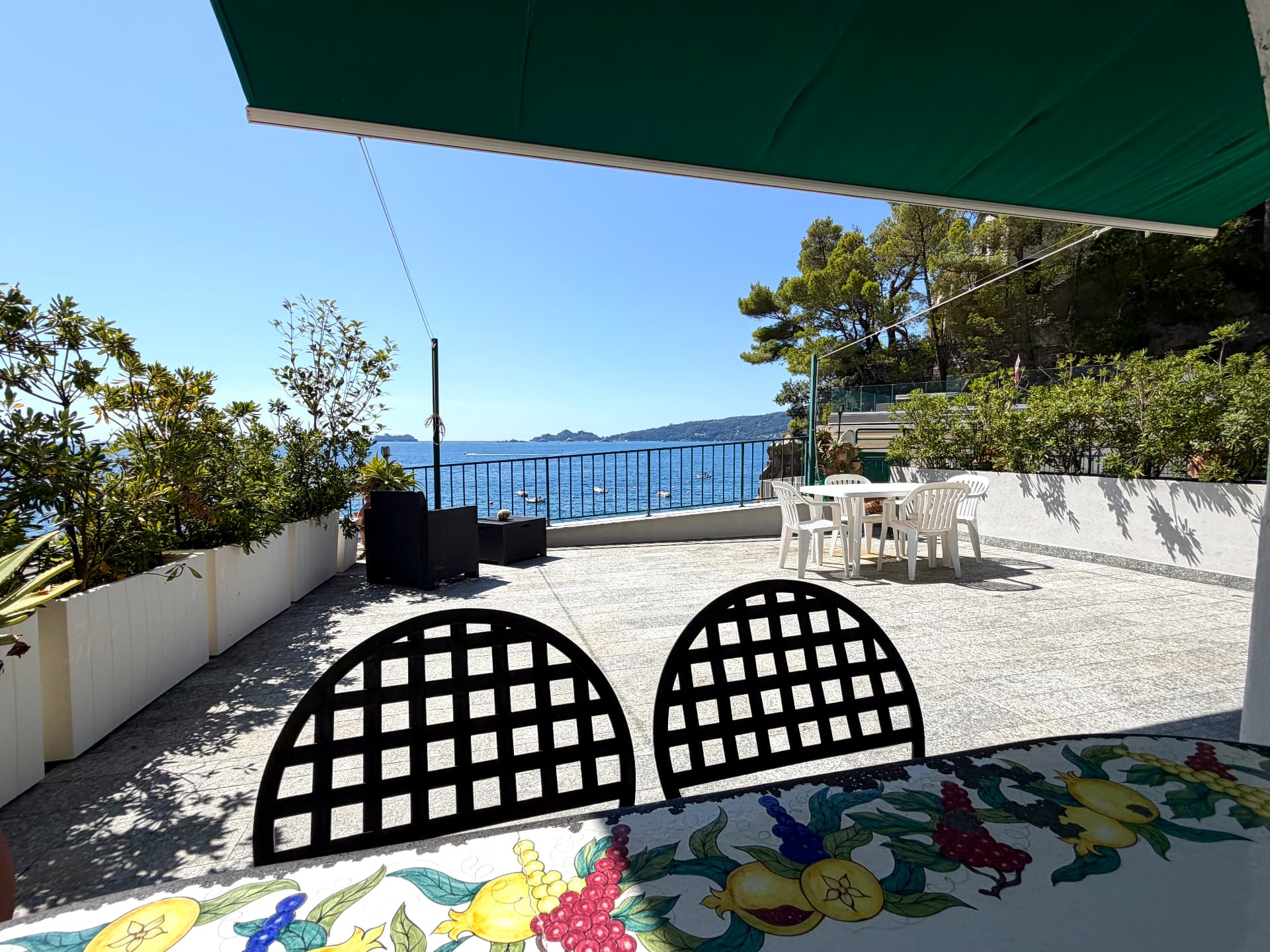 Arched terrace of Villa Maria Luisa framing the Mediterranean